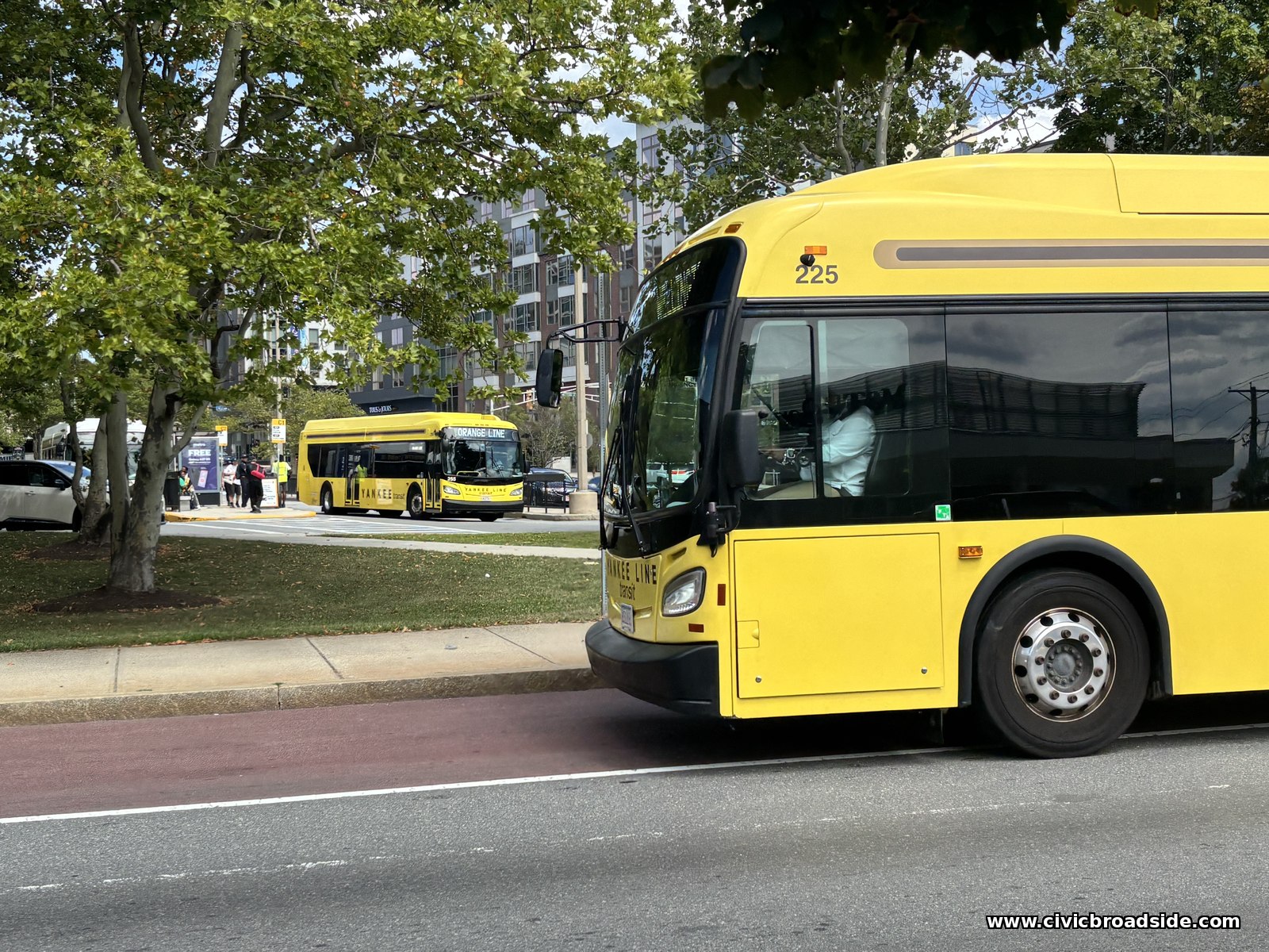 A coach bus in shuttle service on a city street