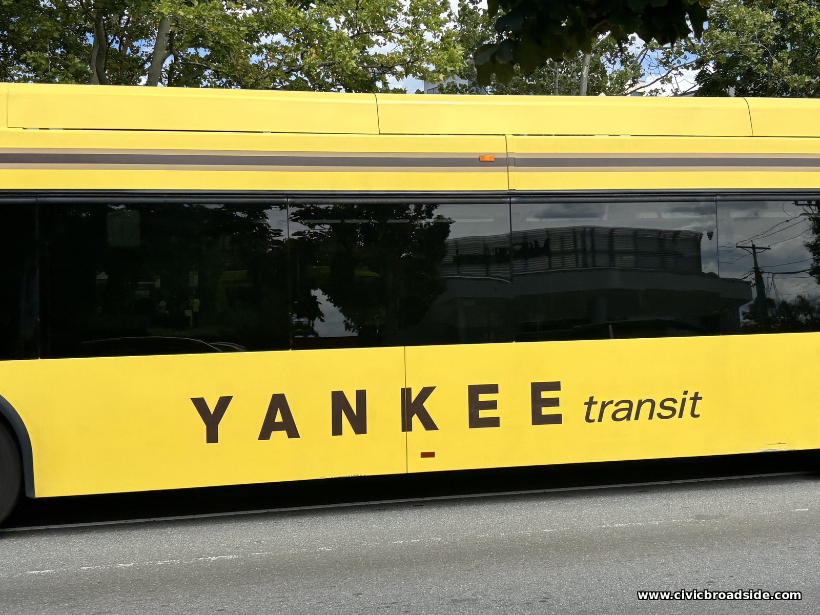 Close-up of a yellow bus reading YANKEE transit