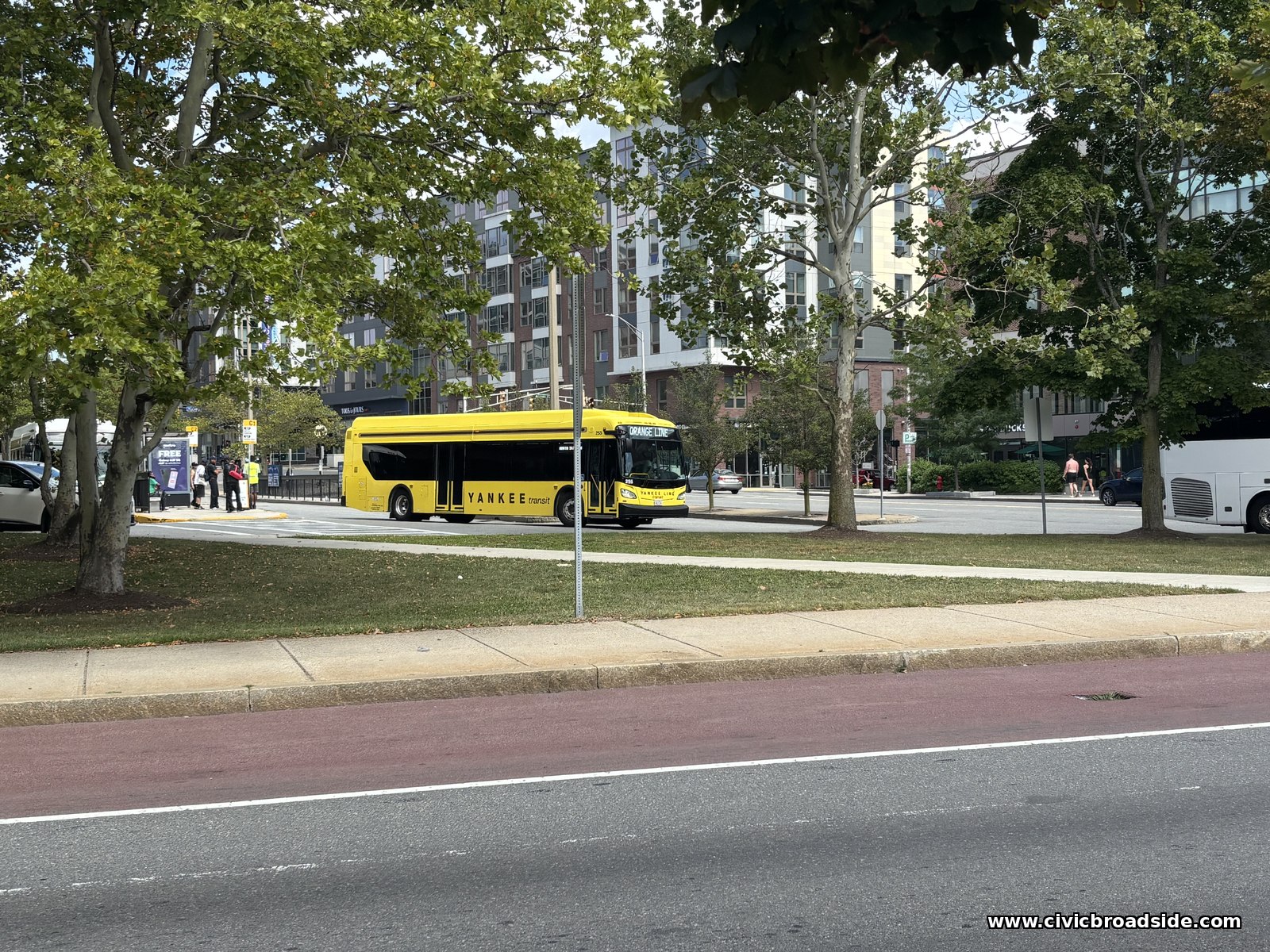 Shuttle buses lined up at a stop